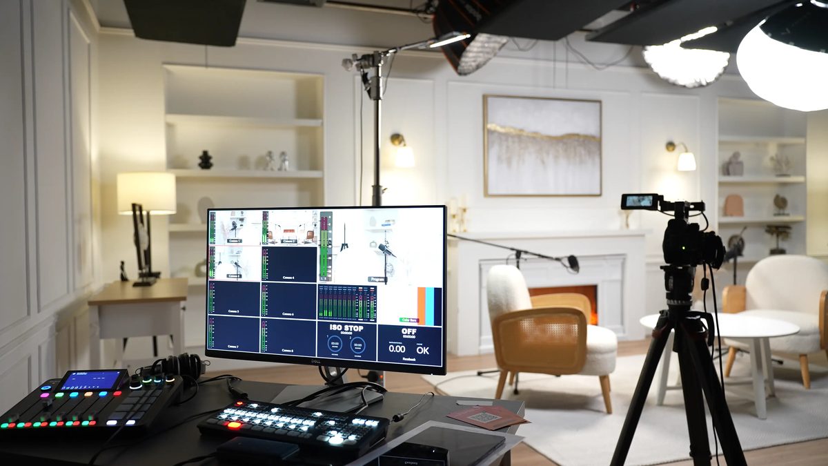 A vision mixer and multi-camera monitor in a bright studio
