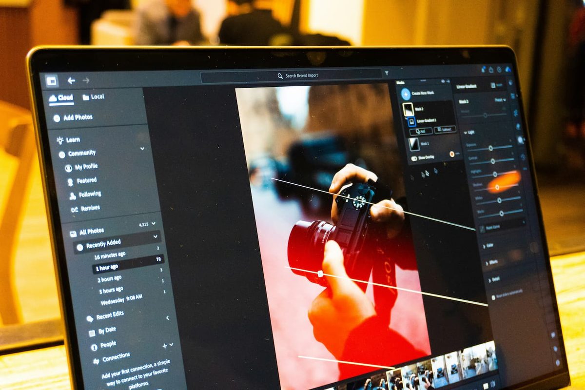 A photo editing application open on a laptop, with an image selected
