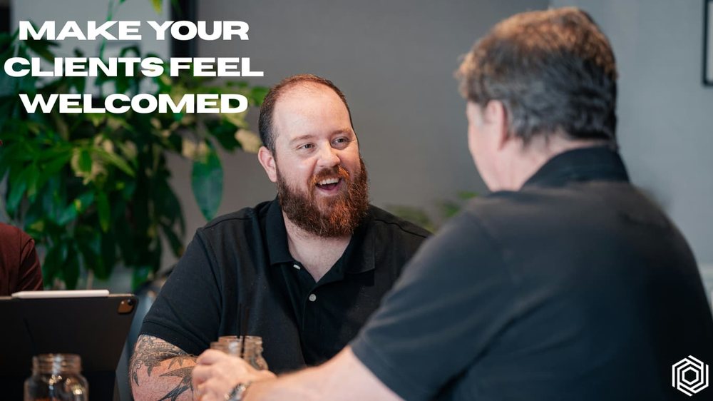 Two people talking warmly in a studio, captioned: make your clients feel welcomed